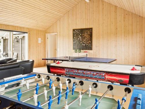 a room with a pool table and ping pong balls at Luxury Retreat by Beach - By Traum Ferienwohnungen in Marielyst