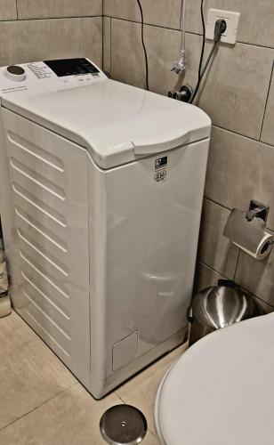 a toilet in a bathroom next to a toilet at Apt. Faraj in Playa de las Americas
