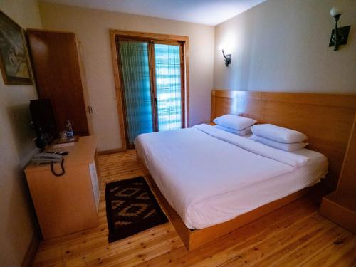Postel nebo postele na pokoji v ubytování Natyral Razma Resort