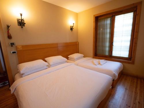 Postel nebo postele na pokoji v ubytování Natyral Razma Resort