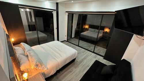 Postel nebo postele na pokoji v ubytování Guadalajara Glamping