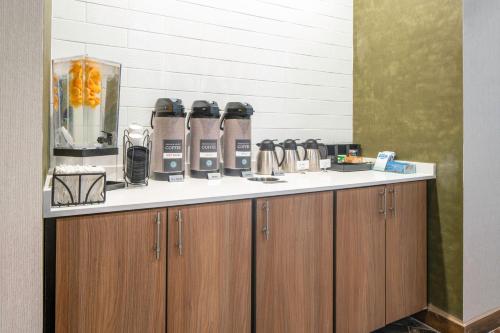 a kitchen with a counter with a coffee maker on it at Fairfield Inn & Suites by Marriott Corinth South Denton Area in Corinth