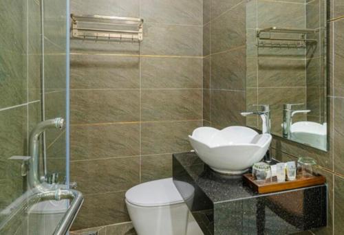 a bathroom with a sink and a toilet at Jewel Hotel in Ho Chi Minh City