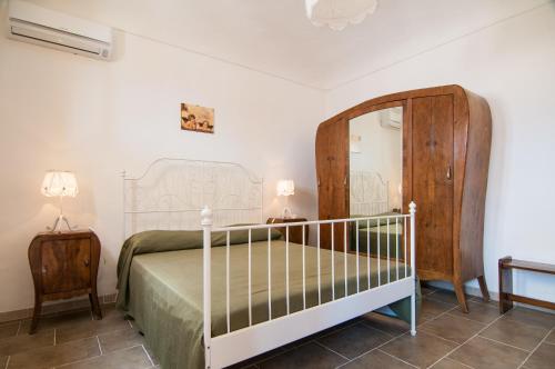 Case Vacanze Ducezio tesisinde bir odada yatak veya yataklar