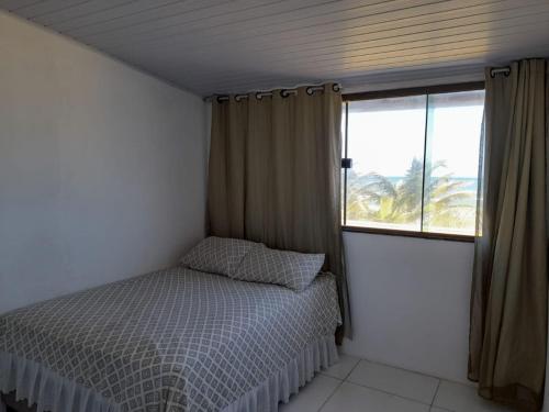 Ένα ή περισσότερα κρεβάτια σε δωμάτιο στο Apartamentos com acesso para praia em Porto de Sauipe