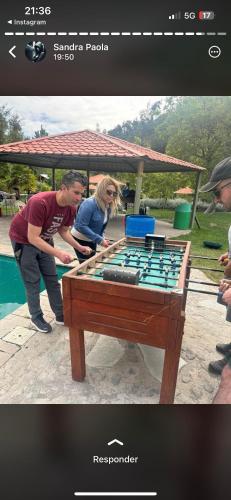 a man and a woman playing a game on a table at CASARMONIA in Peumos