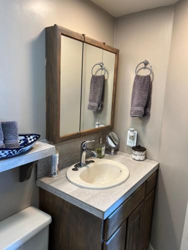 a bathroom with a sink and a mirror at Oceana Casa Del Mar in Rosarito