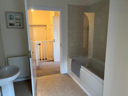 a bathroom with a shower and a sink at 7A Murray Street in Duns