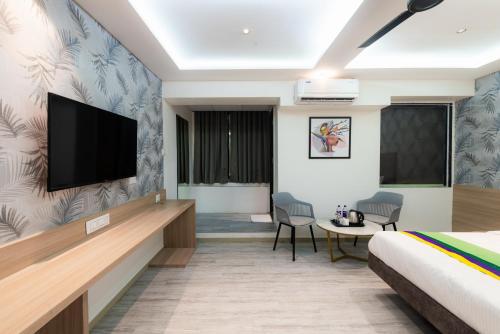 Treebo Cocostay, Hadapsarにあるテレビまたはエンターテインメントセンター