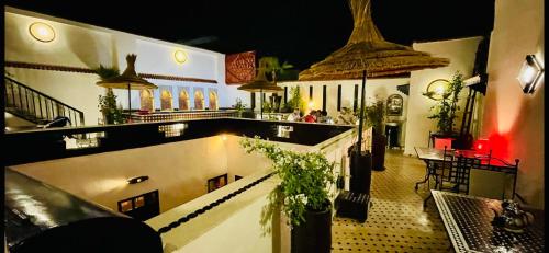 a view of a building with a bar and a restaurant at Dar Najat in Marrakech