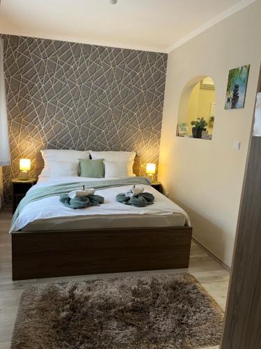 Ένα ή περισσότερα κρεβάτια σε δωμάτιο στο Oreo Apartman