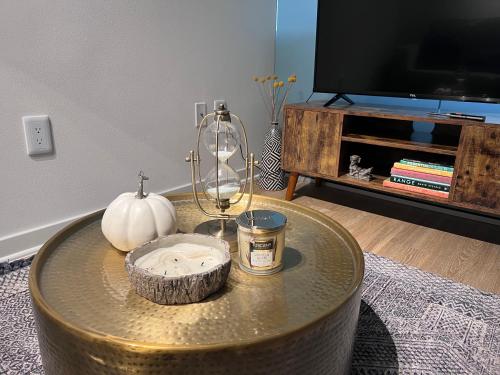 a living room with a table with a pumpkin and a candle at Arion- Cozy Santa Monica getaway steps to the beach Free Parking in Los Angeles