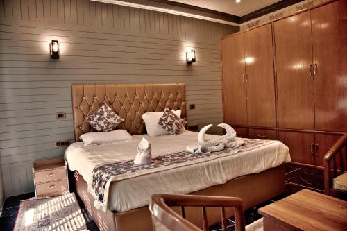 a bedroom with a large bed in a room at The GoodFind Residency in Srinagar