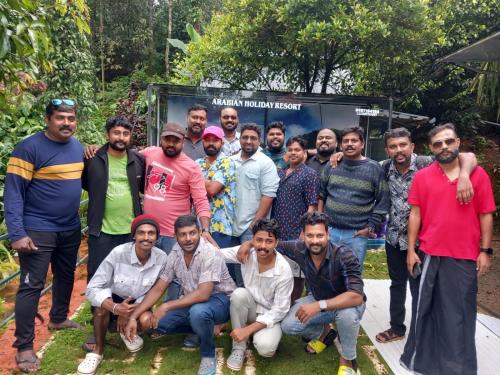 a group of men posing for a picture together at ARABIAN HOLIDAY RESORT WITH SWIMMING POOL IN IDUKKI Calvary Mount in Idukki