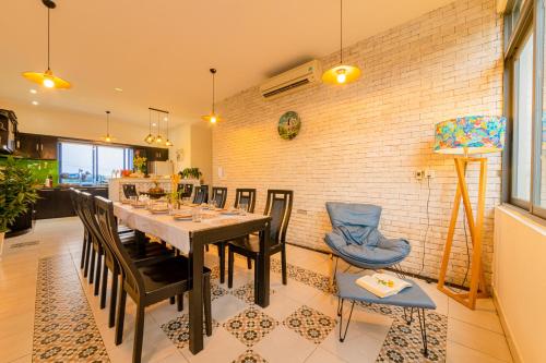 a dining room with a table and chairs at HA Gateway Inn Hoian Priavate Pool Villa in Hoi An