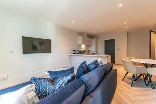 a living room with a couch and a table at 1 Bed Apt - Balcony - City View - Great Location in Liverpool