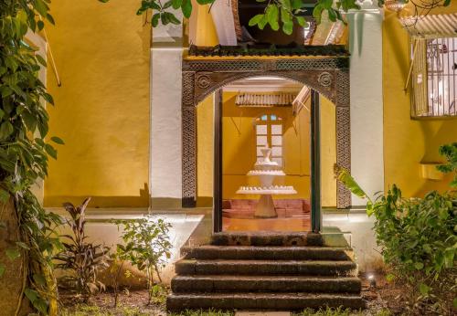 an entrance to a building with stairs in front at Villa Sereno by Insignia Villas in Assagao