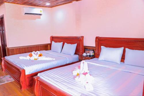 Ліжко або ліжка в номері Rumdual Krong Kep Resort