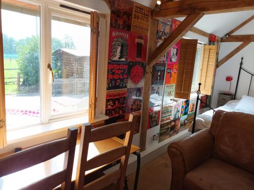 a living room with a window and a couch at Prestwick Oak - Sleeps 10-14 - Group Accommodation for Family or Friends in Haslemere