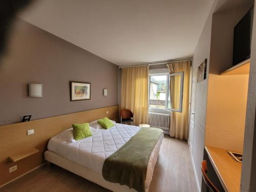 Postel nebo postele na pokoji v ubytování Hotel Fouillade