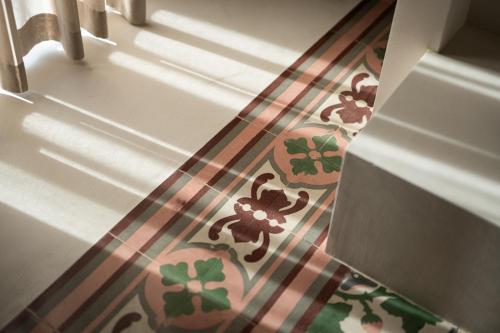 a close up of a door with a floral tile floor at AL PALAZZO La Dimora by Apulia Hospitality in Fasano