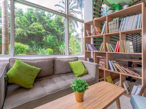 a living room with a couch and a table at Ibis Casablanca City Center in Casablanca