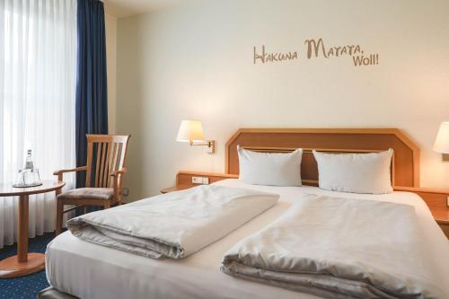 Ένα ή περισσότερα κρεβάτια σε δωμάτιο στο Sunderland Hotel