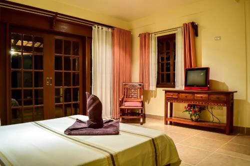 Postel nebo postele na pokoji v ubytování Tribal Hills Mountain Resort