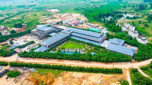 an aerial view of a large building in a city at Mayfair Oasis Resort & Convention in Jhārsuguda