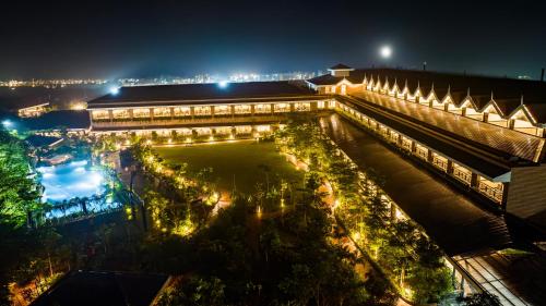 a view of a building at night at Mayfair Oasis Resort & Convention in Jhārsuguda