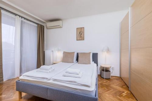 Posteľ alebo postele v izbe v ubytovaní Venus Apartments - Synagogue I