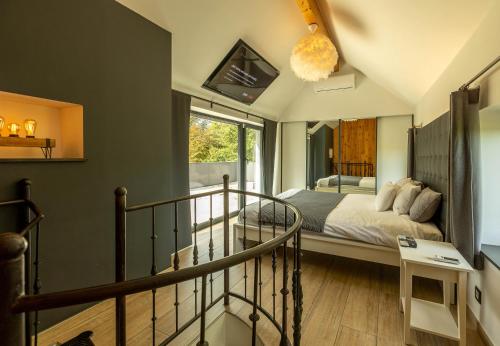 Postel nebo postele na pokoji v ubytování Le Fermage - logement avec piscine, sauna et jacuzzi