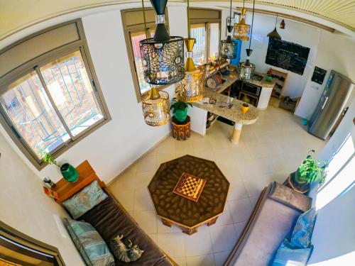an overhead view of a living room and dining room at Atlantic Vibes Surf Hostel in Tamraght Ouzdar