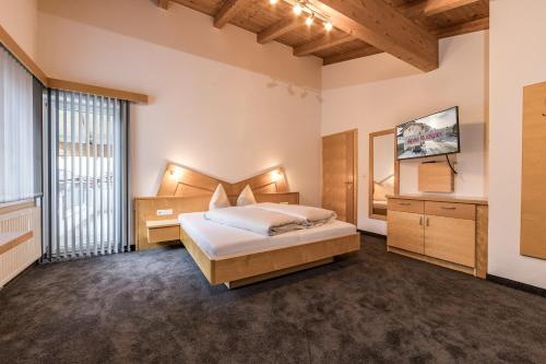 Кровать или кровати в номере Apart Rudigier