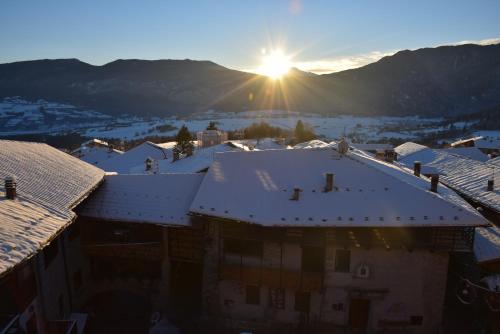 a view of a town with snow covered roofs at Appartamento La Fenice Rango in Balbido-rango