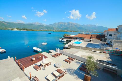 a view of a large body of water with boats at Apartments Dubravcevic in Tivat
