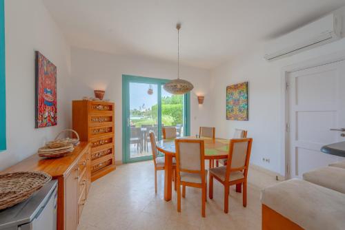 a kitchen and dining room with a table and chairs at Stunning Villa for Rent in El Gouna HEATED PRIVATE POOL in Hurghada