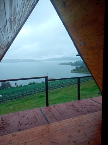 a view of the ocean from the porch of a house at Cabañas el Olimpo in Aquitania