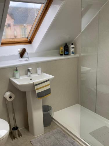 a bathroom with a sink and a shower at 30 College Street, Buckhaven, Leven, Fife, KY81JX in Buckhaven