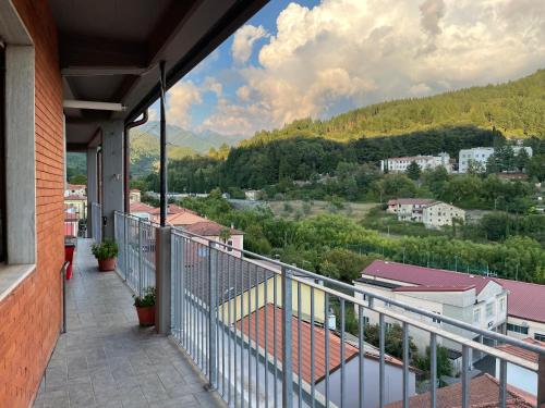 a balcony with a view of a city at Tuscany Hills Penthouse in Fivizzano