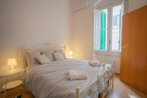 Postel nebo postele na pokoji v ubytování Nonno Orazio