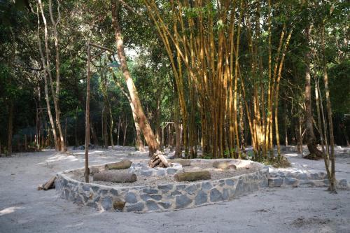 a stone circle with trees in the background at Ashamaya Belitung (Dome Glamping Site) in Pasarbaru