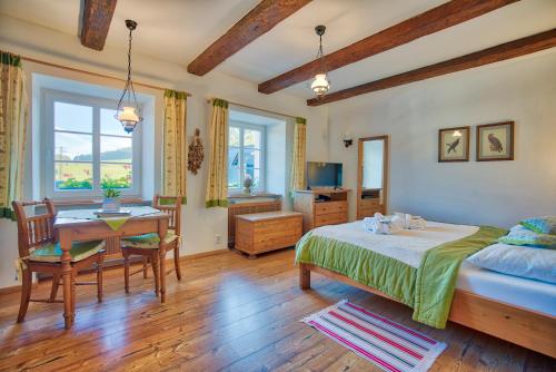 Postel nebo postele na pokoji v ubytování Apartmán-Hotel Jítravský Dvorec