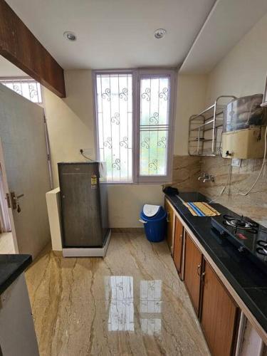 a kitchen with a sink and a counter top at Ankhi's Villa with Parking in Amritsar