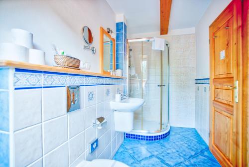 a bathroom with a toilet and a sink and a shower at Apartmán-Hotel Jítravský Dvorec in Rynoltice