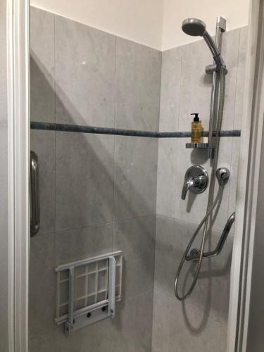 a shower in a bathroom with a glass door at Appartamento Laura in Merano