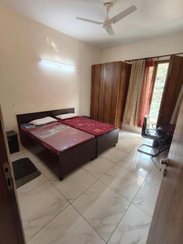 Un pat sau paturi într-o cameră la Colombia's Pearl