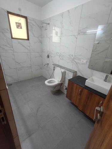 a bathroom with a toilet and a sink and a mirror at Colombia's Pearl in Bogotá