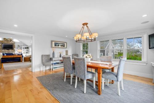 a dining room with a table and chairs at 201 Main Street Chatham Cape Cod - - Sandpiper in Chatham