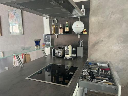 a kitchen with a counter with a sink in it at Villa mit pool in Siegburg